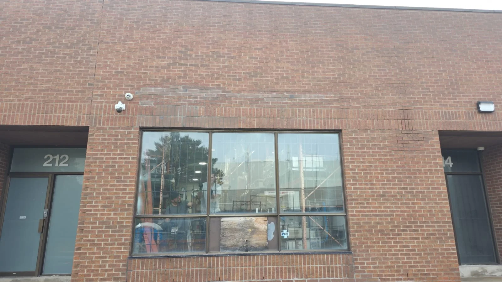 Wide view of glazed openings in a brick commercial frontage